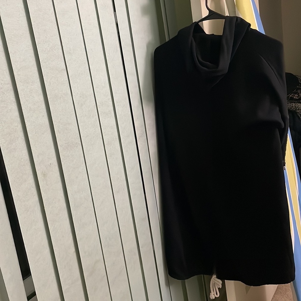That is a sweatshirt. It is long and very black. - Picture 3 of 4
